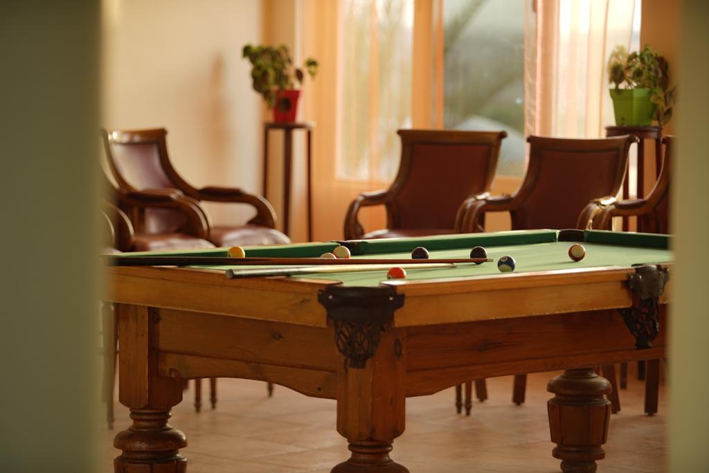 Billiards room with leather armchairs
