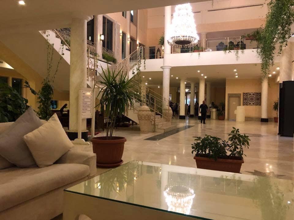 Grand lobby with chandelier and marble floors