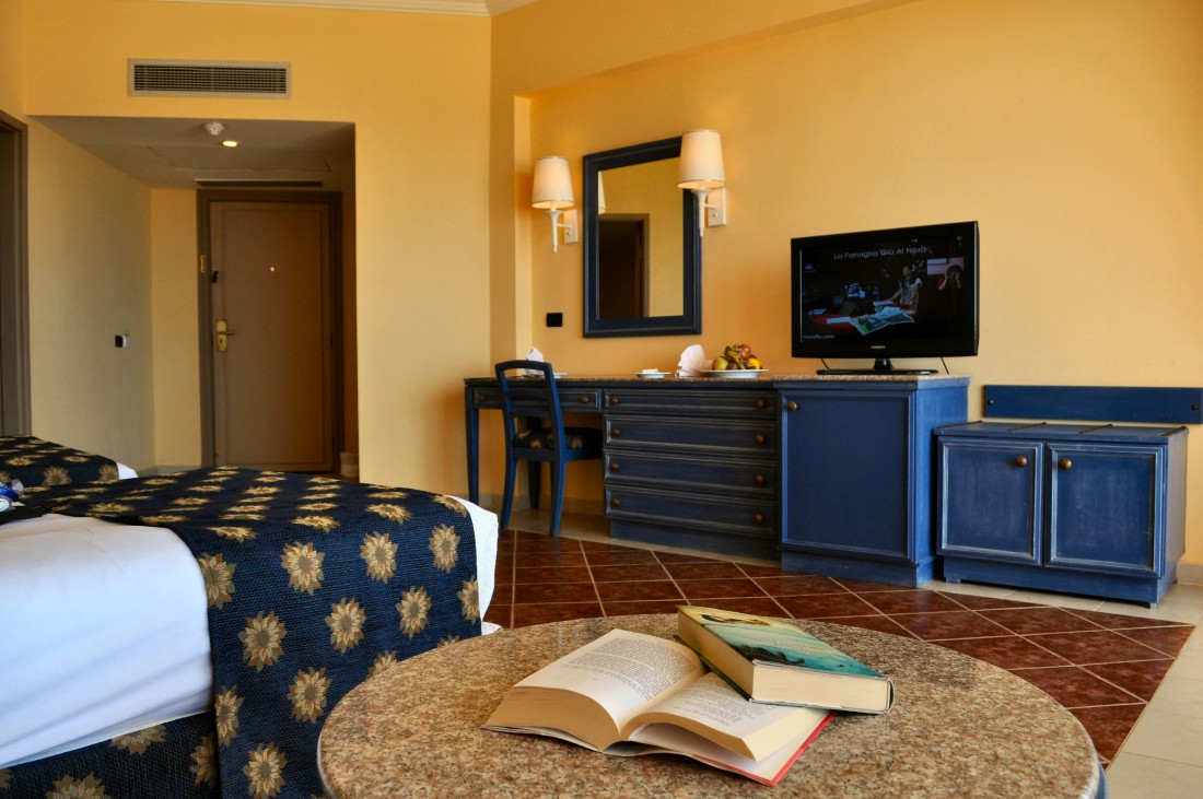 Mediterranean-style room with hand-painted blue furnishings